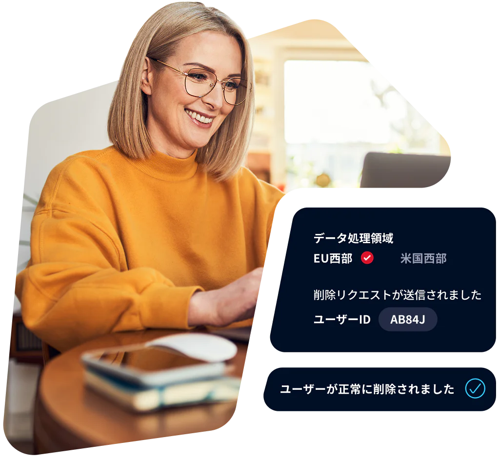 Woman in yellow sweater at laptop reviewing data processing request with status displayed.