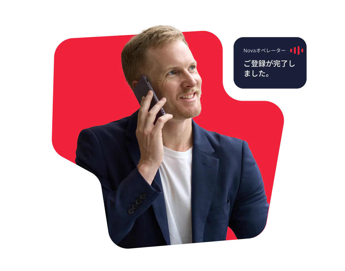 Man Talking on the Phone with Booking Confirmation Smiling man in a blue blazer on a phone call with a booking confirmation message.