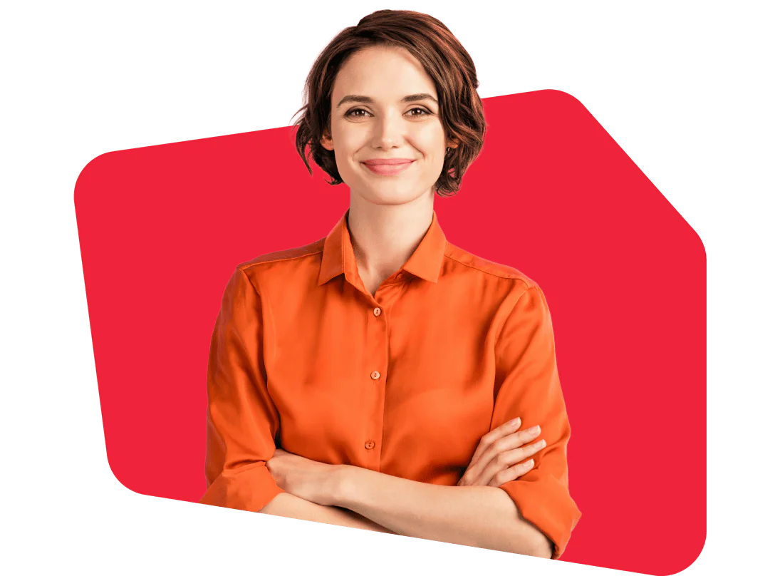 Woman wearing an orange shirt stands confidently with arms crossed against a red background.