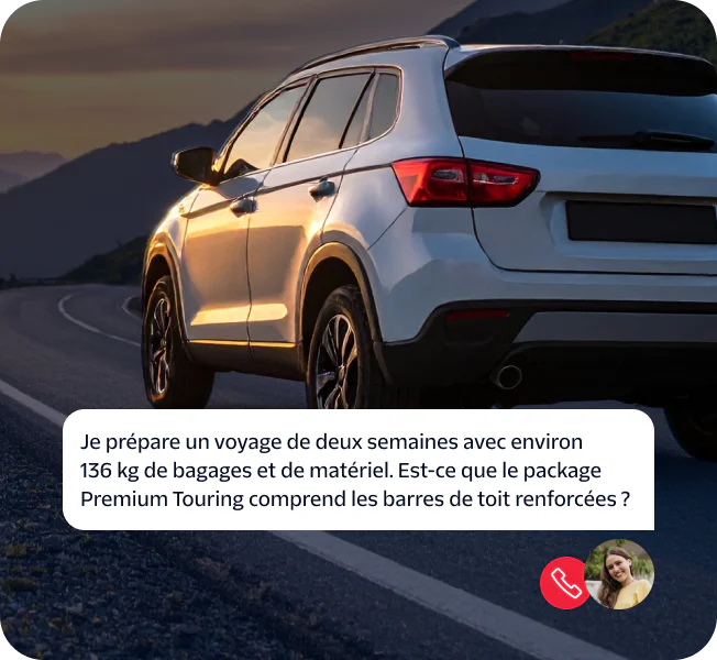 SUV on winding road at dusk with a woman's chat bubble asking about reinforced roof rails.