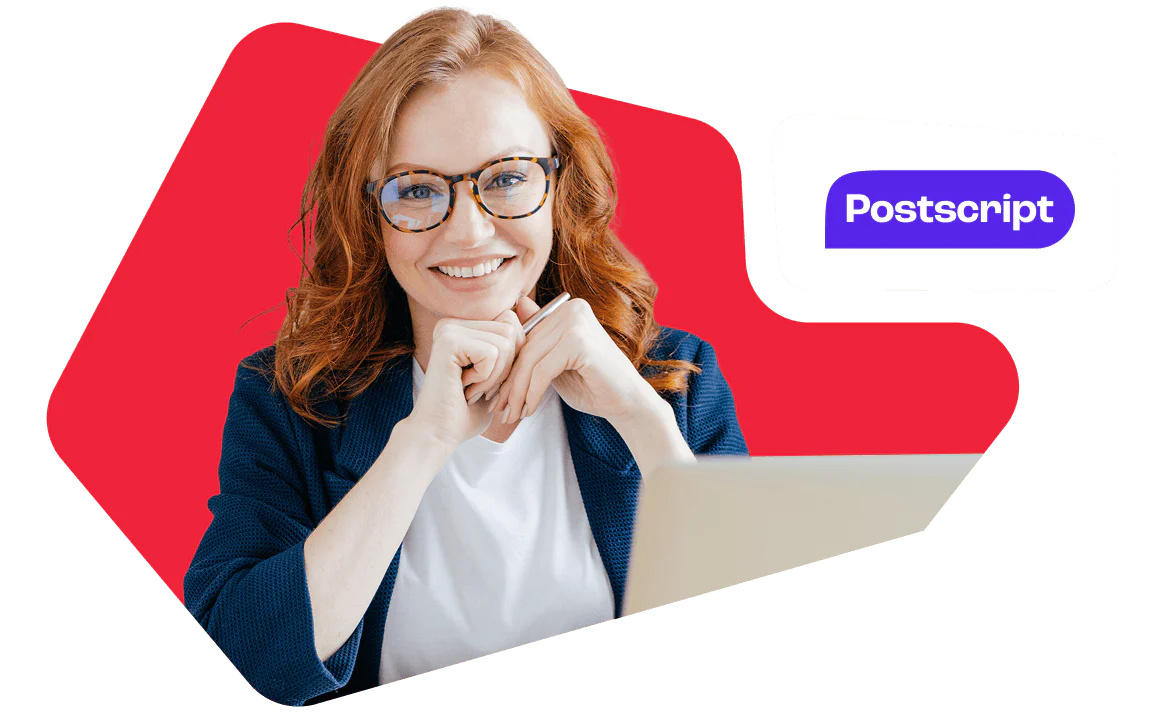 Redheaded woman with glasses smiles, sitting at a laptop, with the Postscript logo in the background.