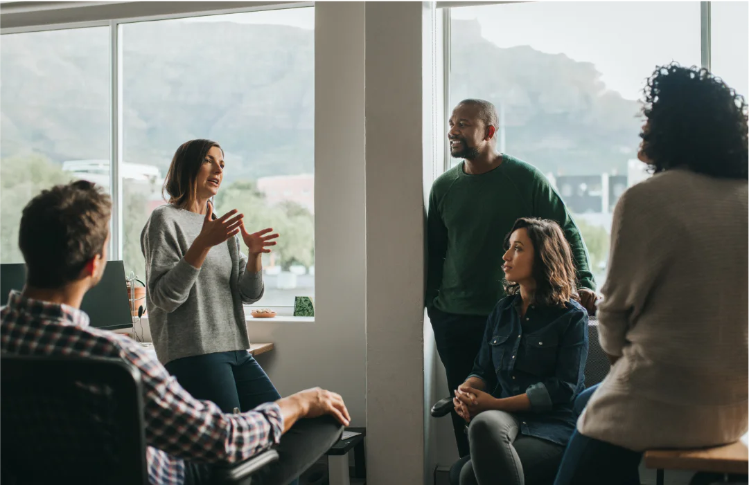 Coworkers discussing the importance of an emergency contact alert notification system