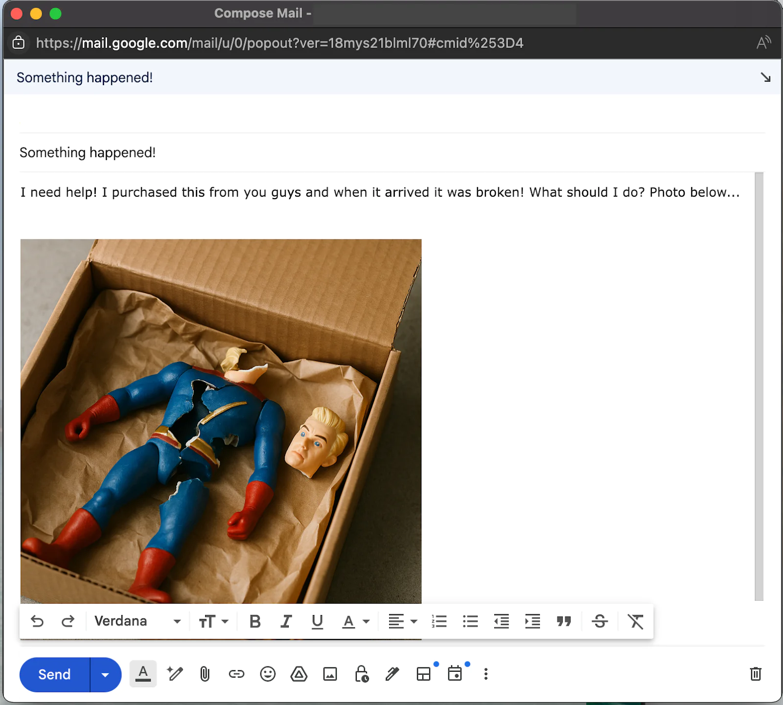Headless action figure in blue and red suit inside a brown box next to a detached head.