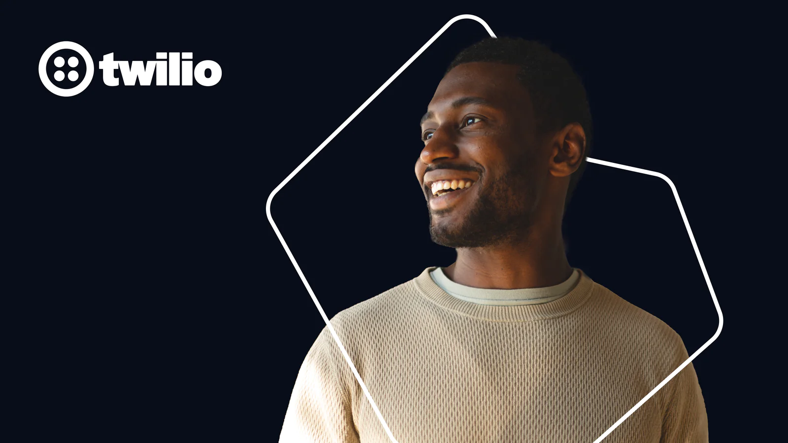 Man smiling with Twilio logo on a dark background.