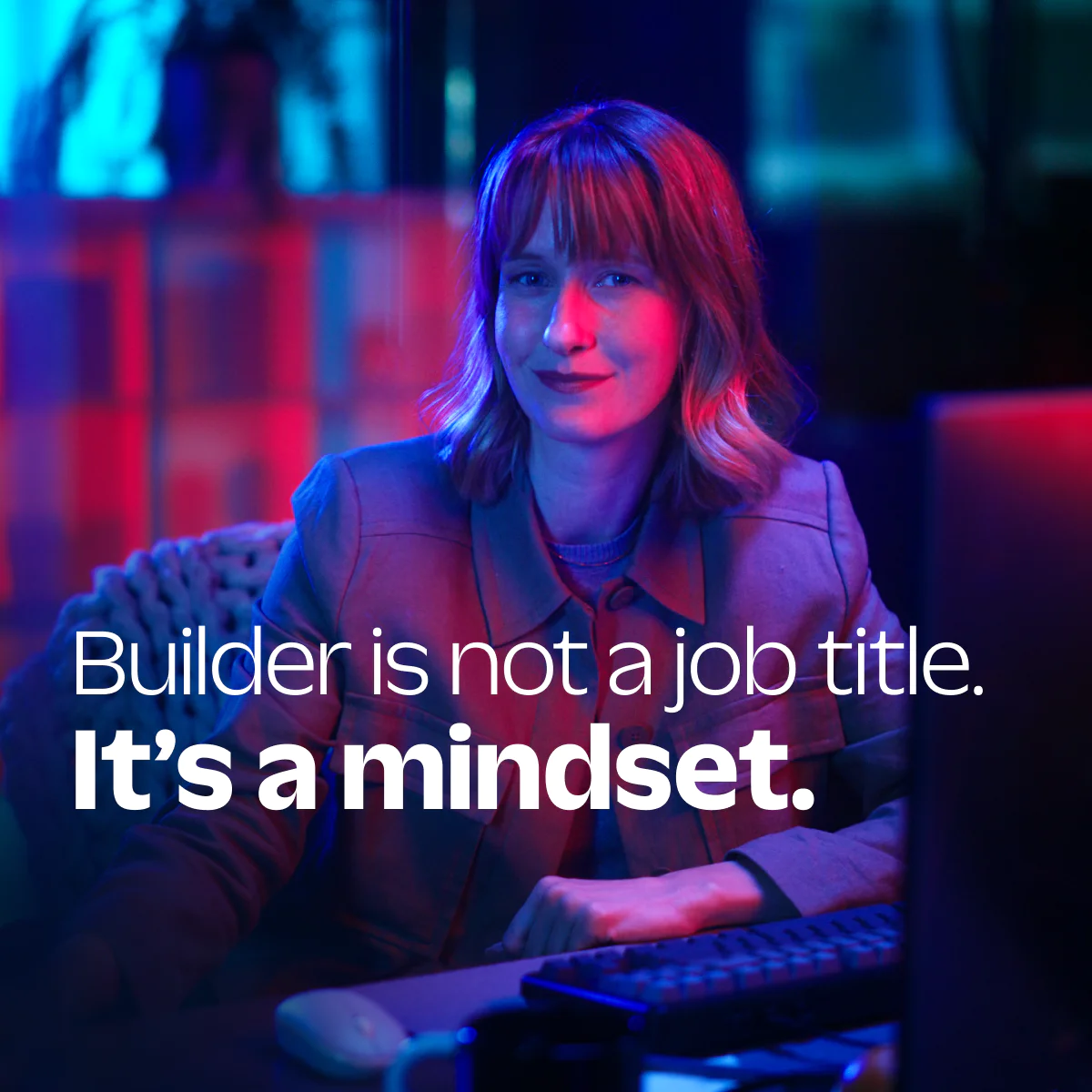 Empowering Builder Mindset Woman in business attire with motivational text overlay about the builder mindset.