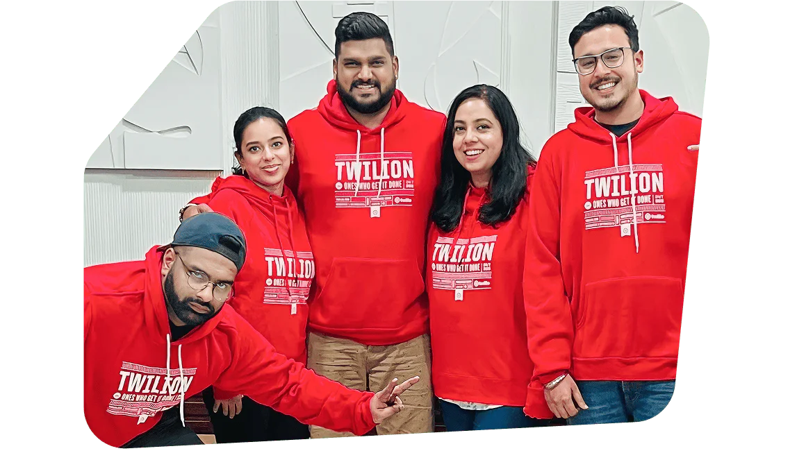 Group of People in Red Hoodies Posing Together A group of happy Twilio employees