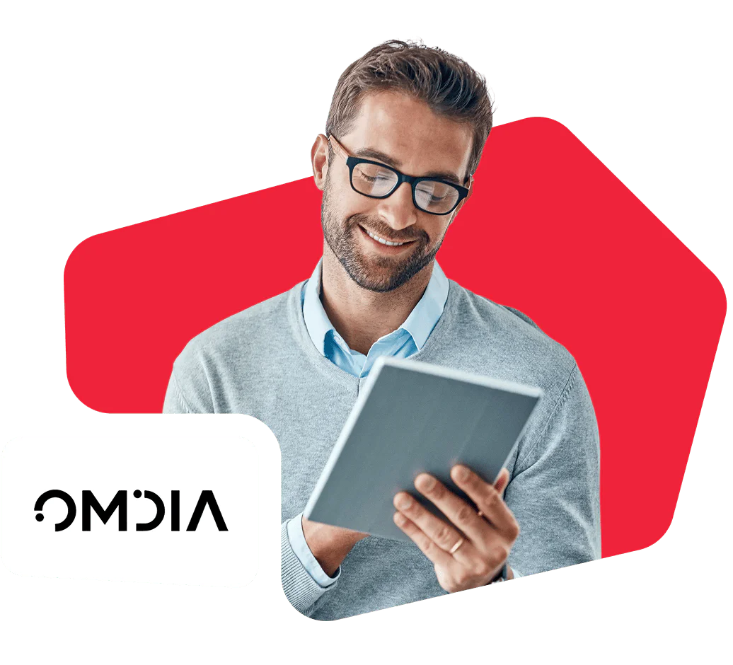 Man in glasses reading on tablet with red background and Omdia logo.
