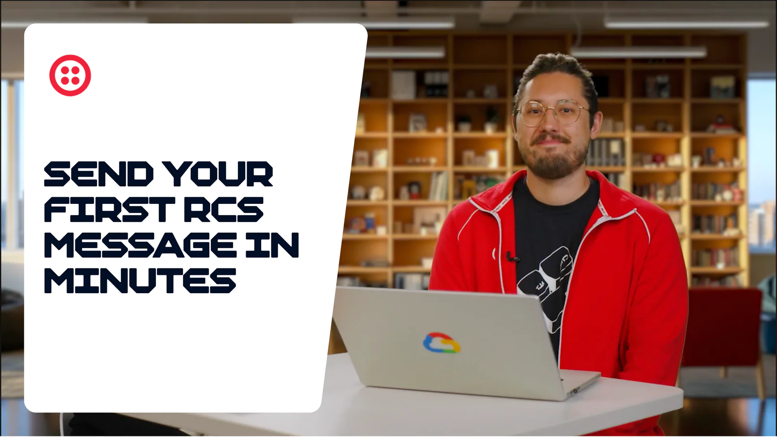Man in red jacket at desk with laptop displaying a tutorial on sending RCS messages quickly.