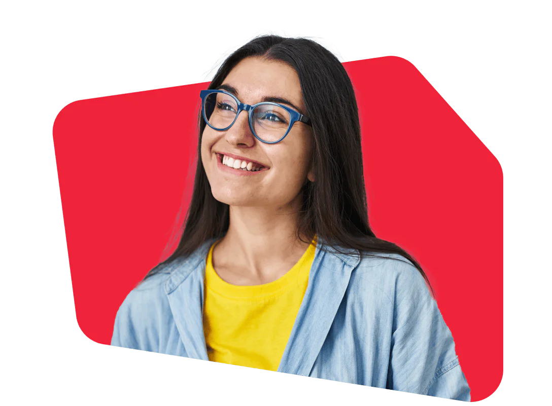 Woman smiling, wearing blue glasses and a yellow shirt, with a bright red background.