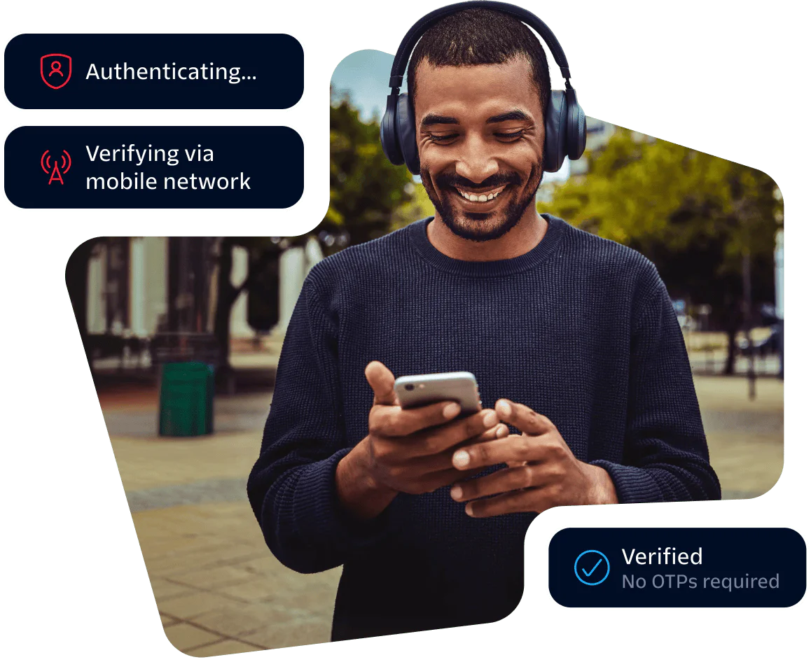 Man wearing headphones smiling at phone with authentication and verification prompts