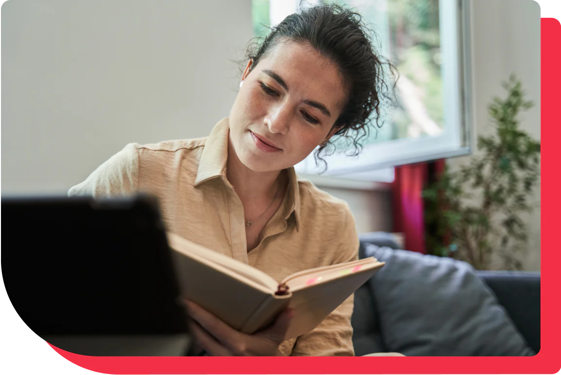 A woman reading about her career growth.