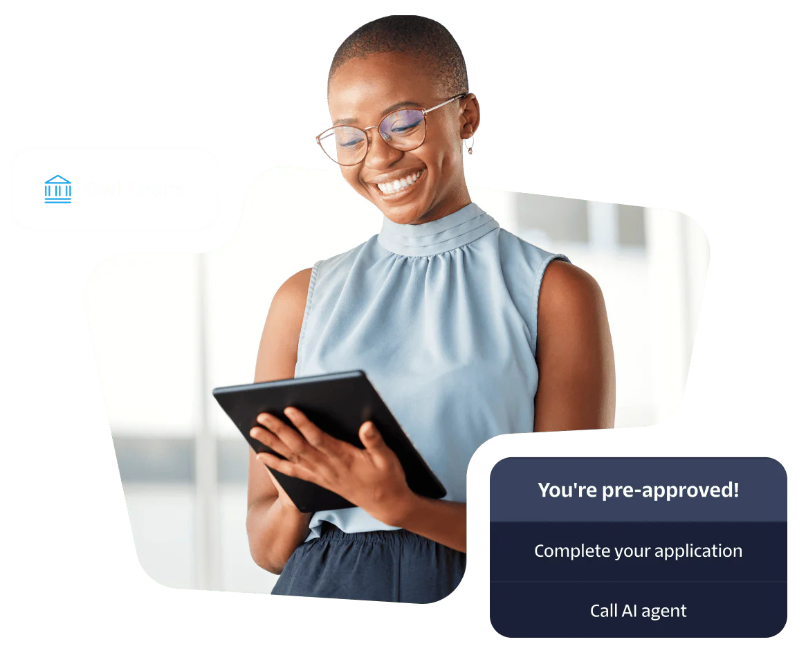 Smiling woman using a tablet for a loan application with Owl Loans and pre-approval notification.