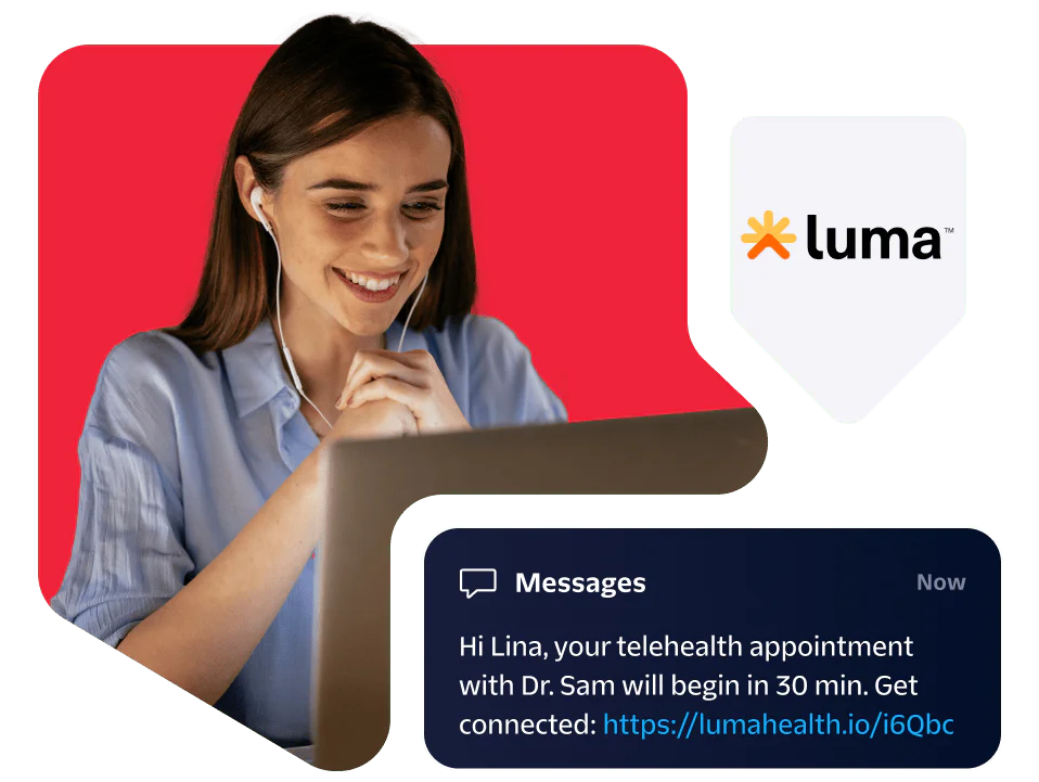 Woman using a laptop with a message notification about a telehealth appointment from Luma.