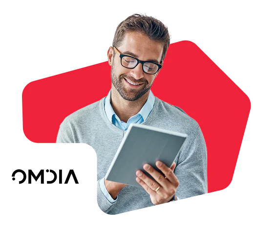 Man in glasses reading on tablet with red background and Omdia logo.