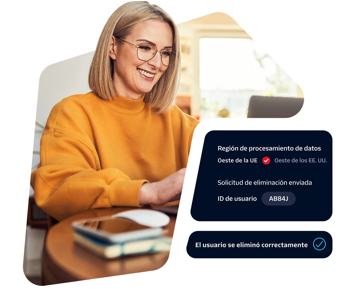 Woman in yellow sweater at laptop reviewing data processing request with status displayed.