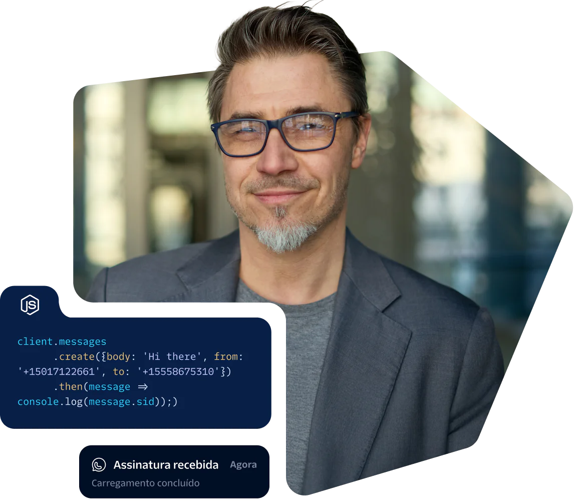 Man in glasses and blazer with programming code overlay and a notification saying Upload completed.