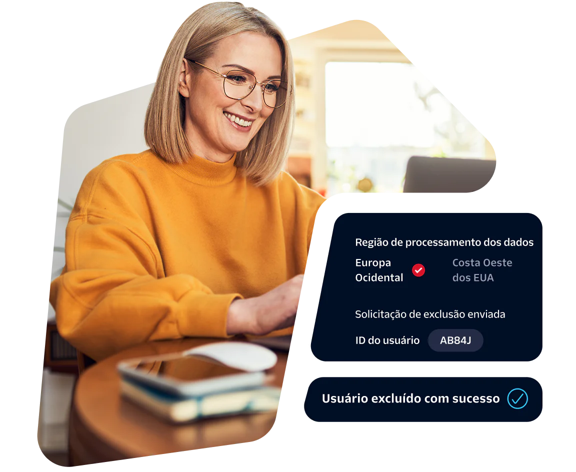 Woman in yellow sweater at laptop reviewing data processing request with status displayed.